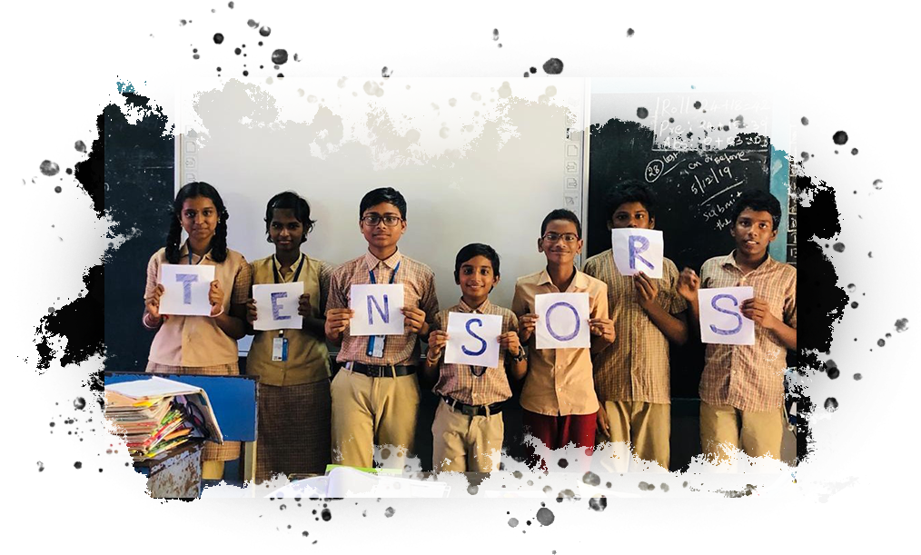 Tensors students holding letters that spell TENSORS in a classroom